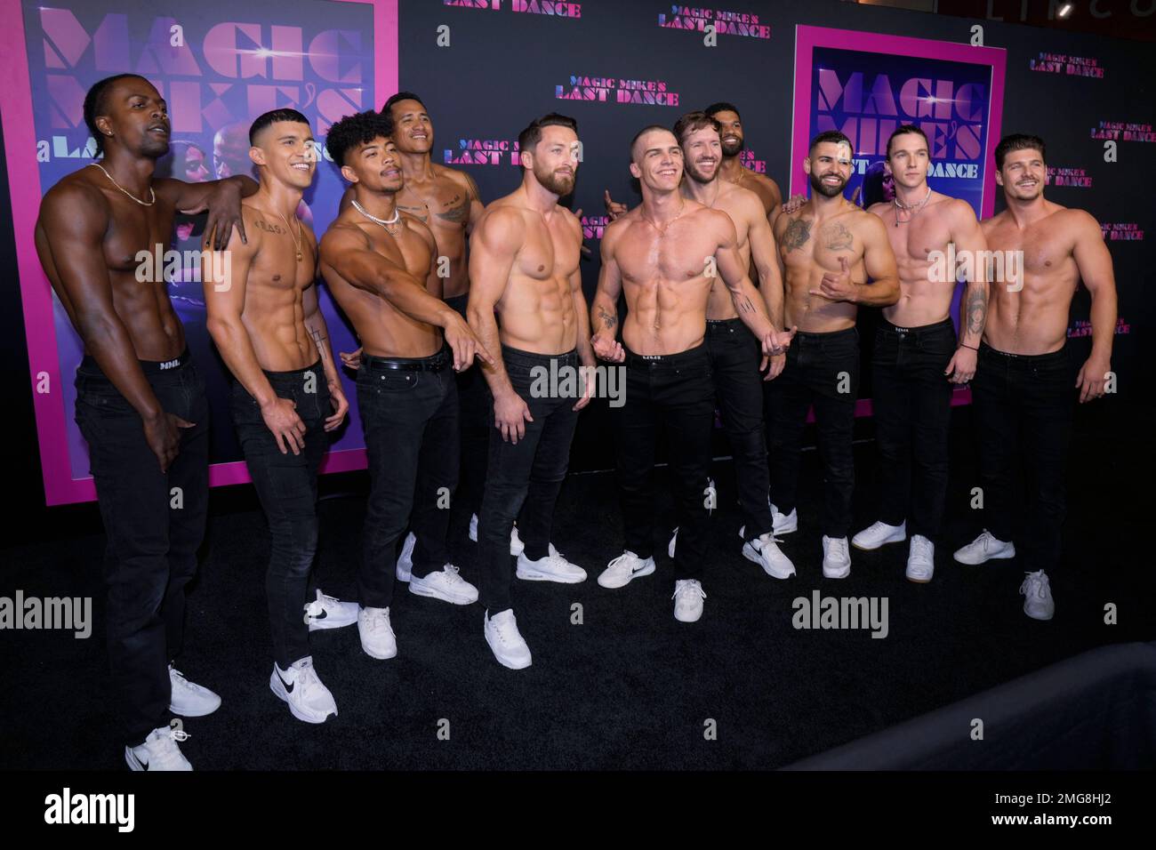 Dancers from the show "Magic Mike Live," pose on the red carpet at the