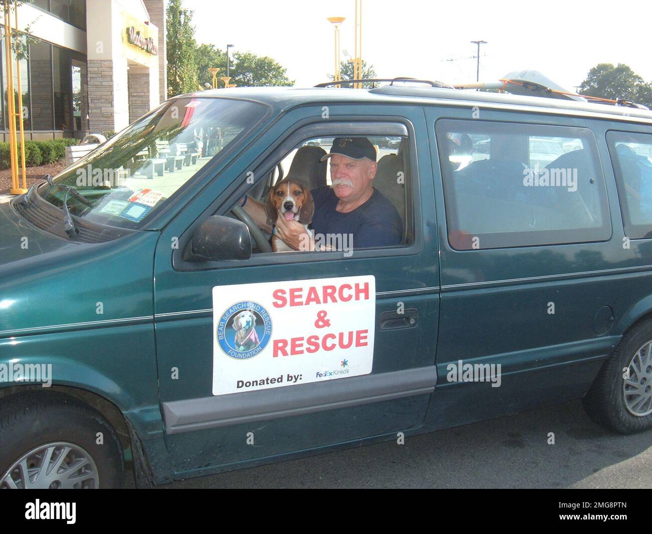 Animals - 26-HK-59-66. personnel inside search-and-rescue vehicle with dog-- 0509 16. Hurricane Katrina Stock Photo