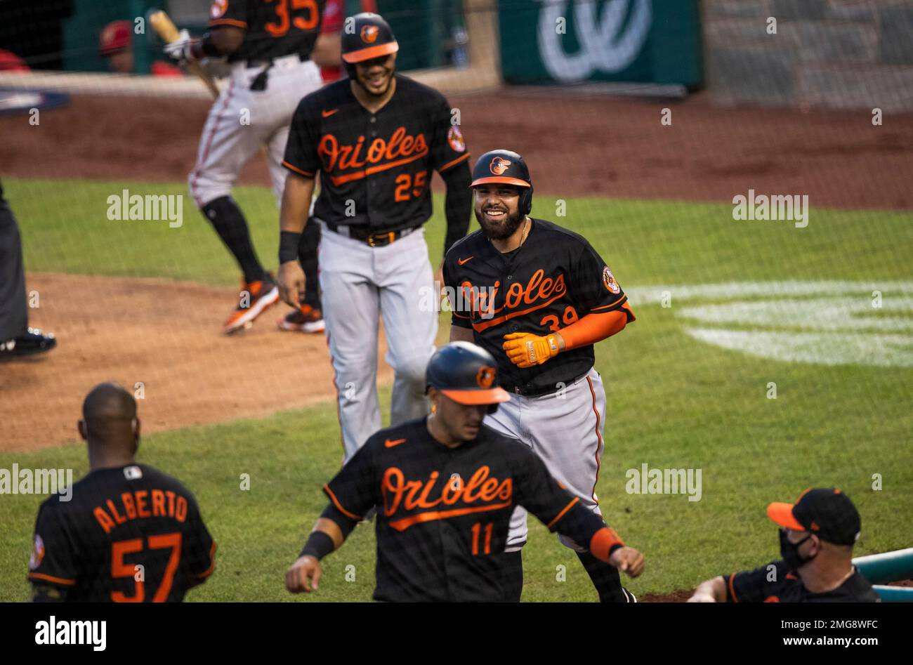 Baltimore Orioles' Renato Nunez (39) and teammates Anthony Santander (25)  and Jose Iglesias (11) run to their dugout after Nunes hit a three-run home  run during the sixth inning of a baseball