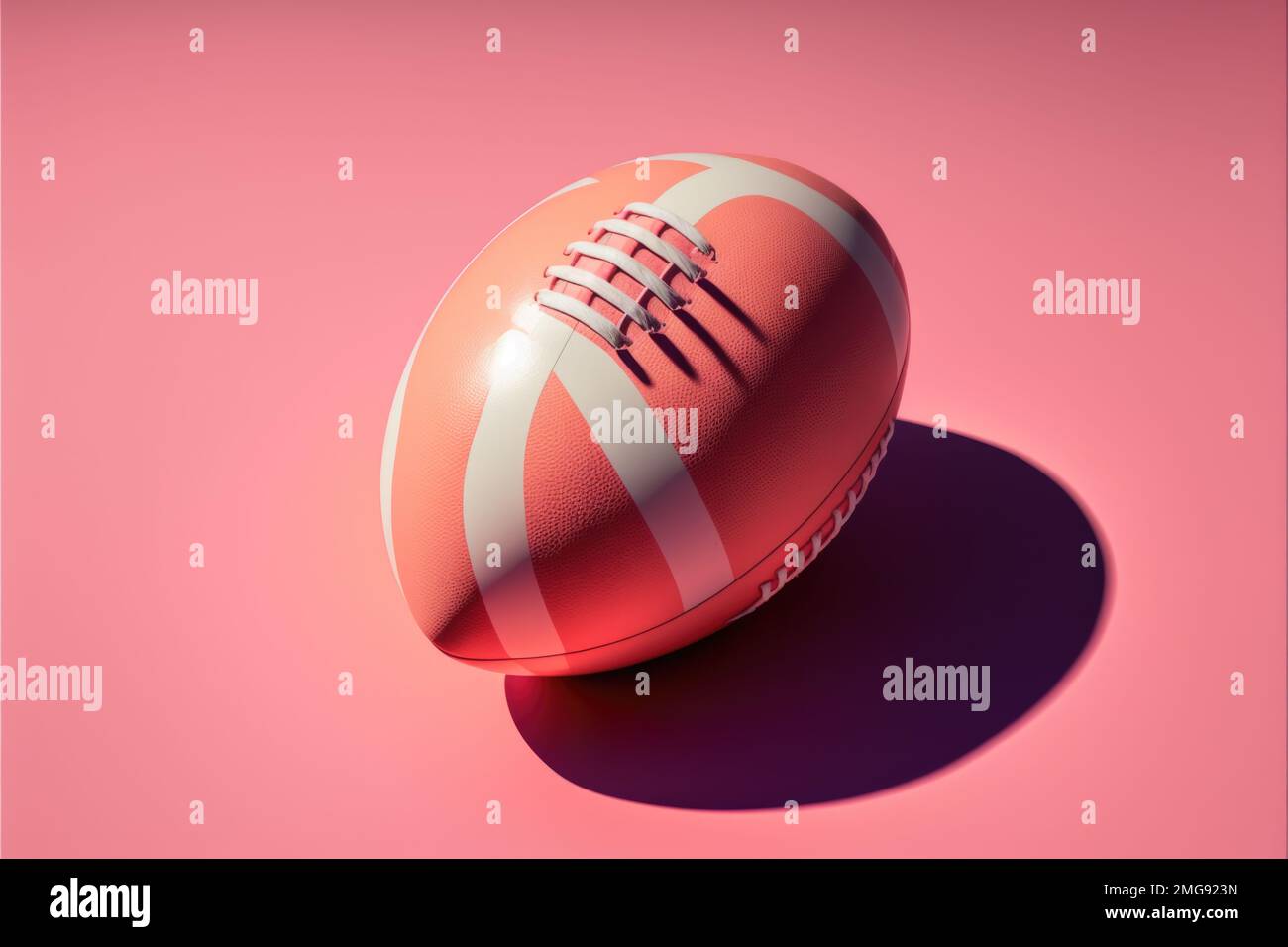 Pink American football rugby ball with hard shadow on pink background ...