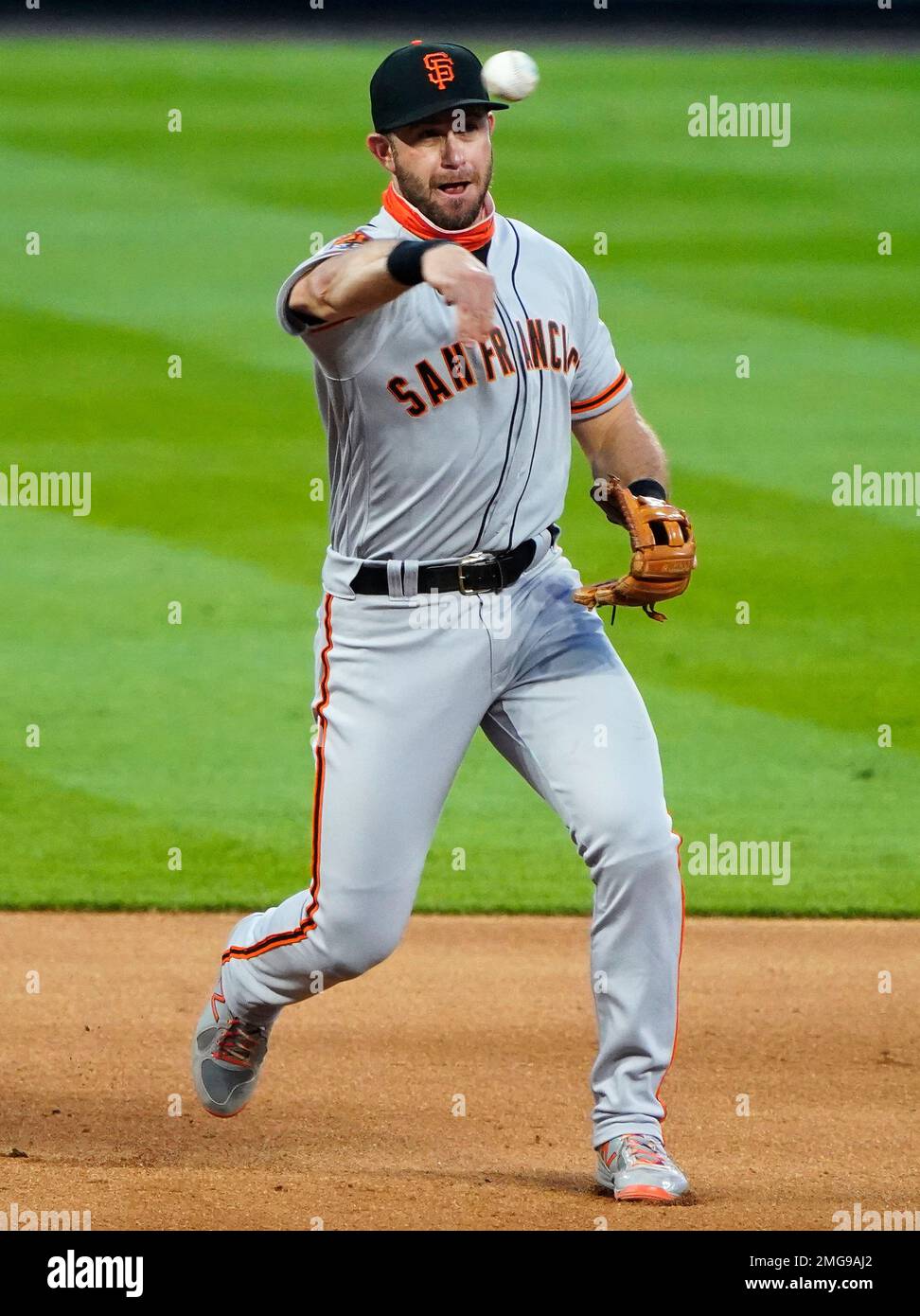 San Francisco Giants third baseman Evan Longoria throws to first