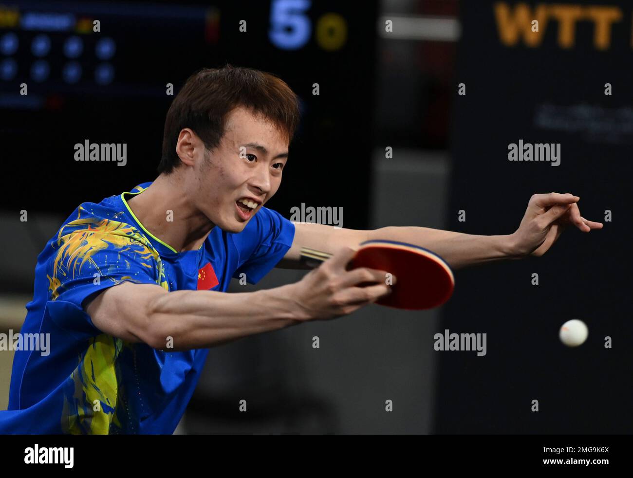 Doha, Qatar. 25th Jan, 2023. Xu Haidong of China hits a return during ...