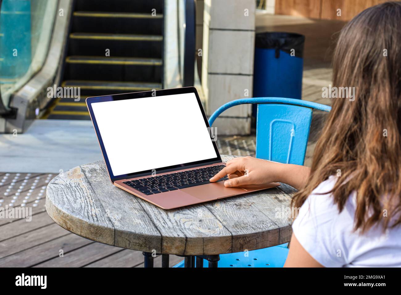 Little girl using laptop at table in street cafe Stock Photo - Alamy