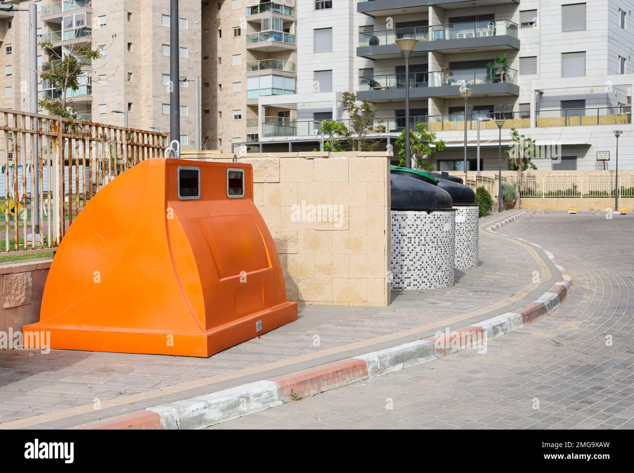 Garbage containers on city street Stock Photo Alamy