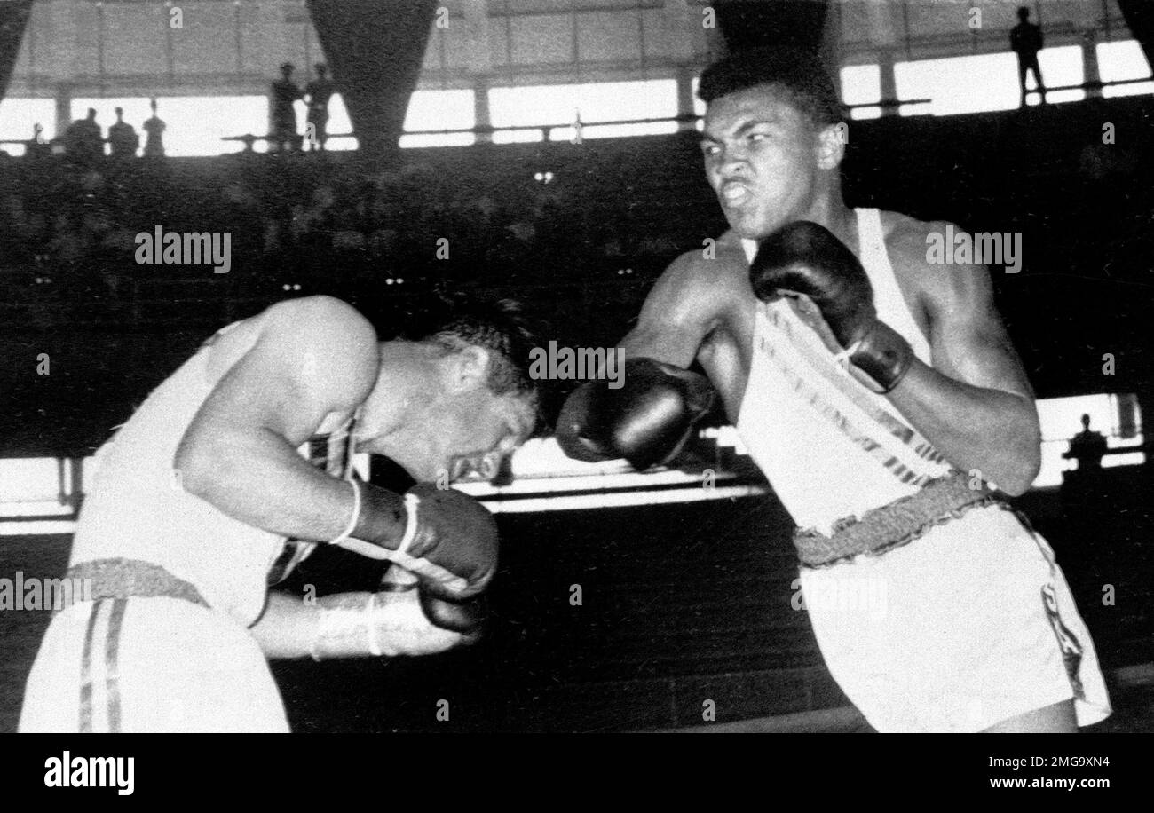 FILE - In this Sept. 3, 1960, file photo, Cassius Clay, 18-year-old from  Louisville, Ky., throws a right at Tony Madigan of Australia, left, during  the light heavyweight boxing semi-finals at the