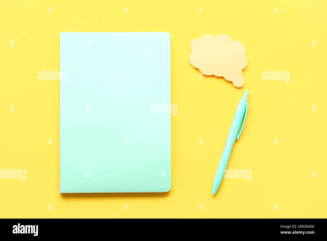 Notebook, pen and sticky notes on yellow background Stock Photo