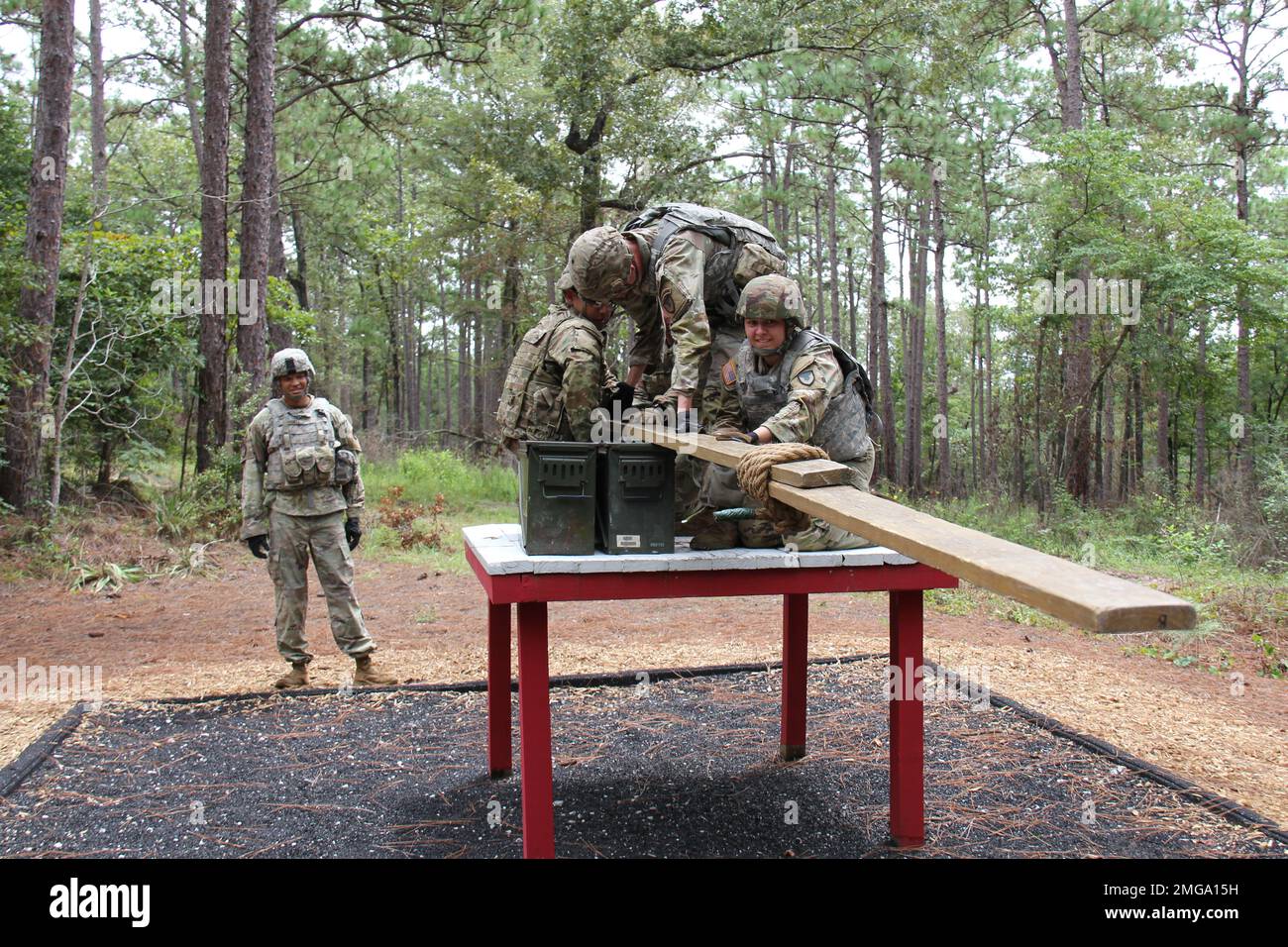 The AMC Best Squad navigates an obstacle at the leadership reaction