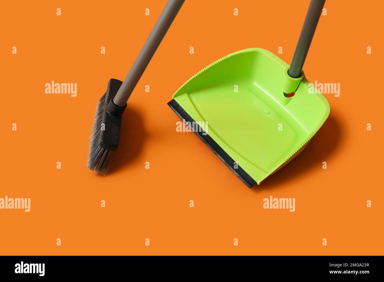 Plastic dustpan with cleaning broom on color background Stock Photo Alamy
