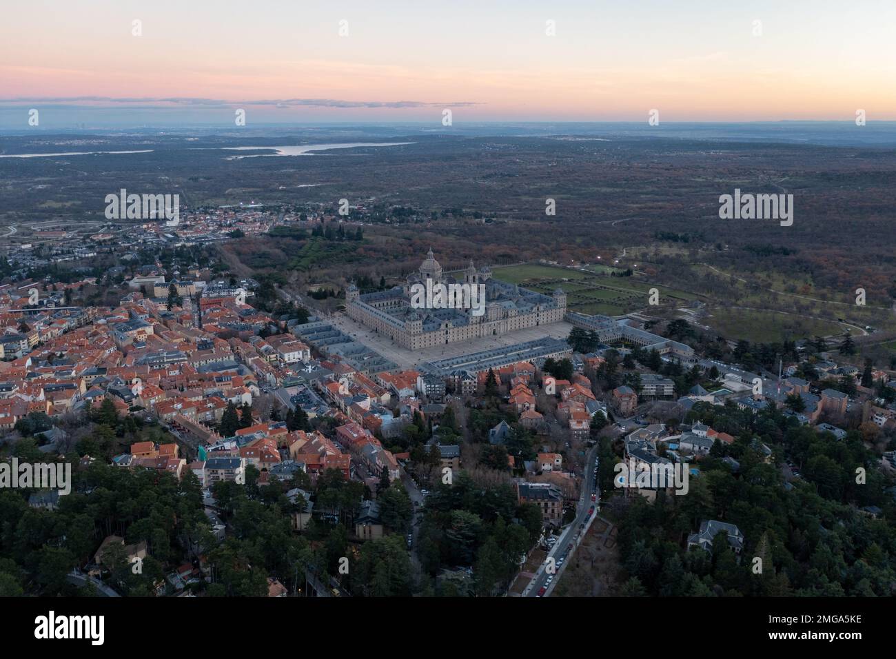 View of the impressive monastery of El Escorial at sunset, a world heritage site in Spain. Stock Photo