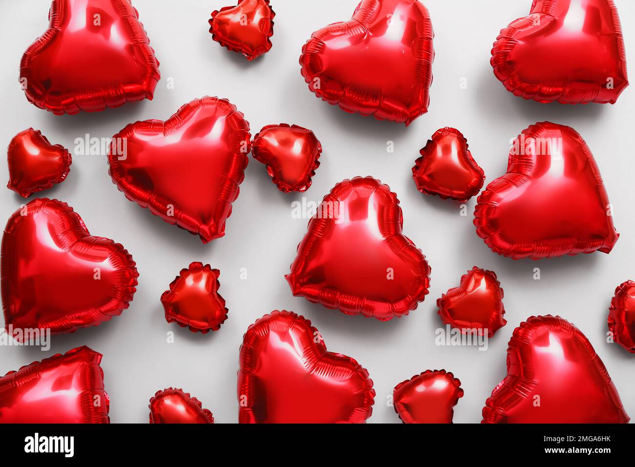 Many red heart shaped balloons on light background. Valentine's Day ...