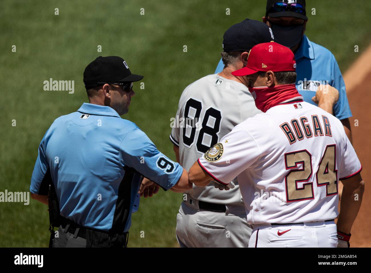 Home plate umpire Will Little (93) greets Washington Nationals bench ...