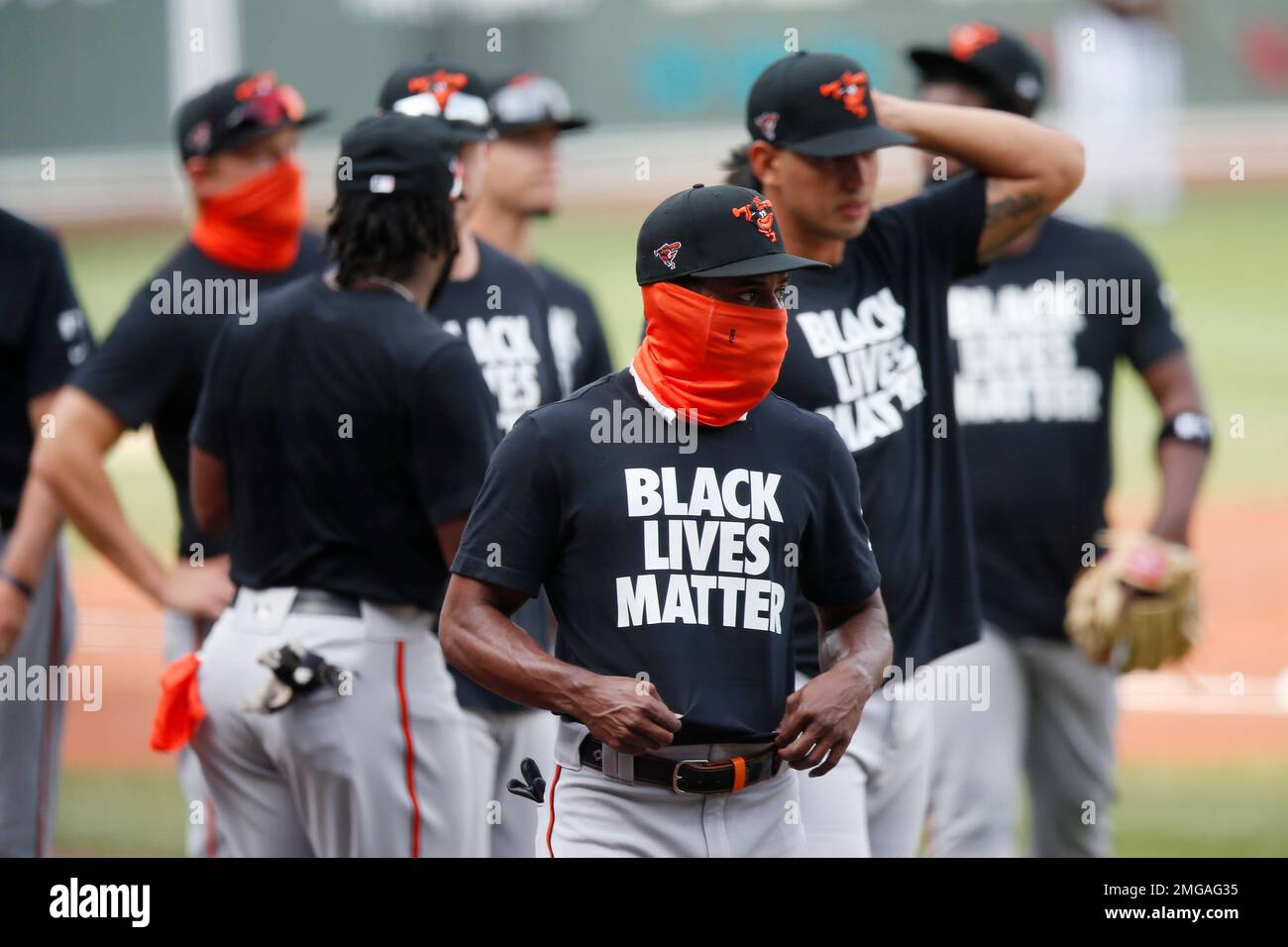 Baltimore Orioles players warm up in Black Lives Matter T-shirts before an  opening day baseball game against the Boston Red Sox at Fenway Park,  Friday, July 24, 2020, in Boston. (AP Photo/Michael