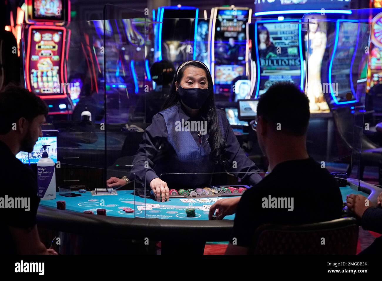 FILE In this June 4, 2020 file photo, people play blackjack at the