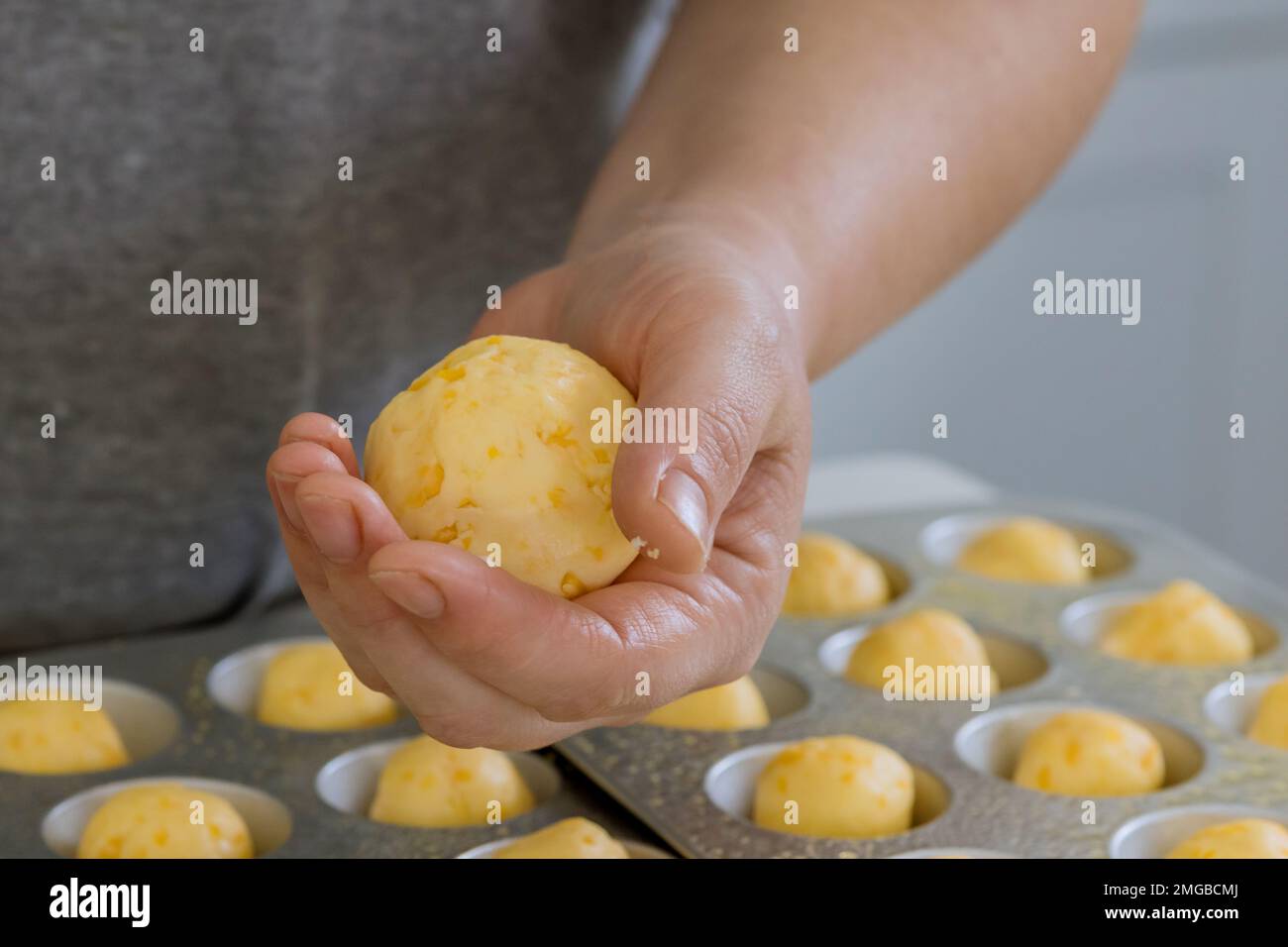 Baking Brazilian cheese buns chipa traditionally used as snacks are prepared at home using recipes that traditional to country Stock Photo
