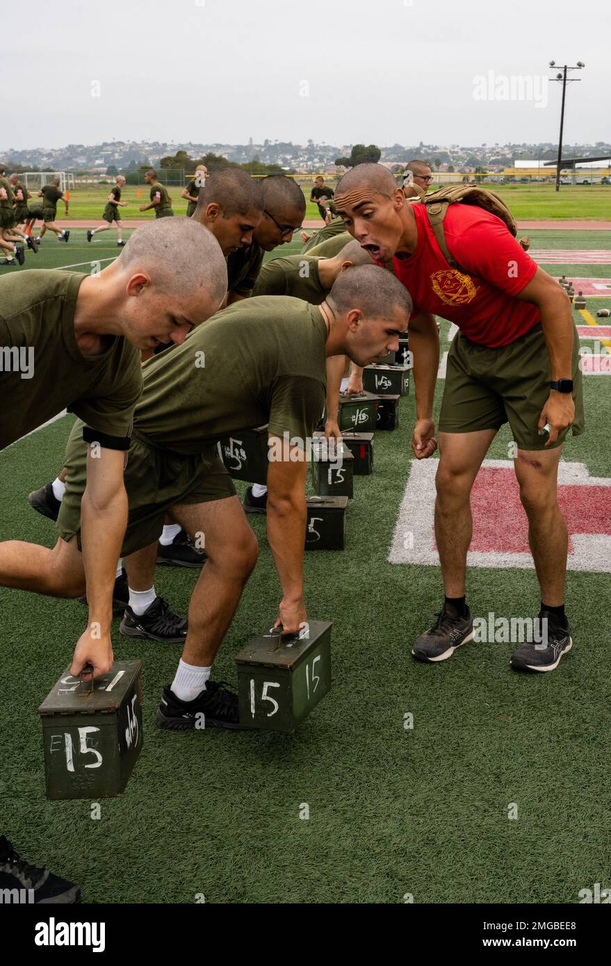 A U.S. Marine Corps drill instructor with Delta Company, 1st Recruit  Training Battalion, motivates recruits during physical training at Marine  Corps Recruit Depot San Diego, Aug. 23, 2022. Recruits completed a circuit