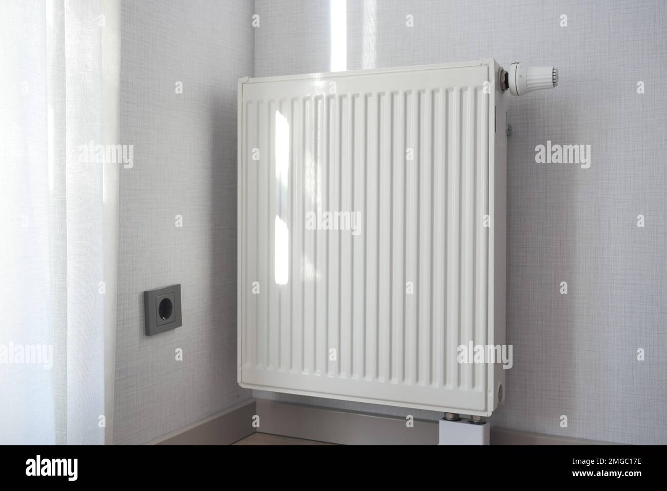 heating radiator under window in the room Stock Photo Alamy