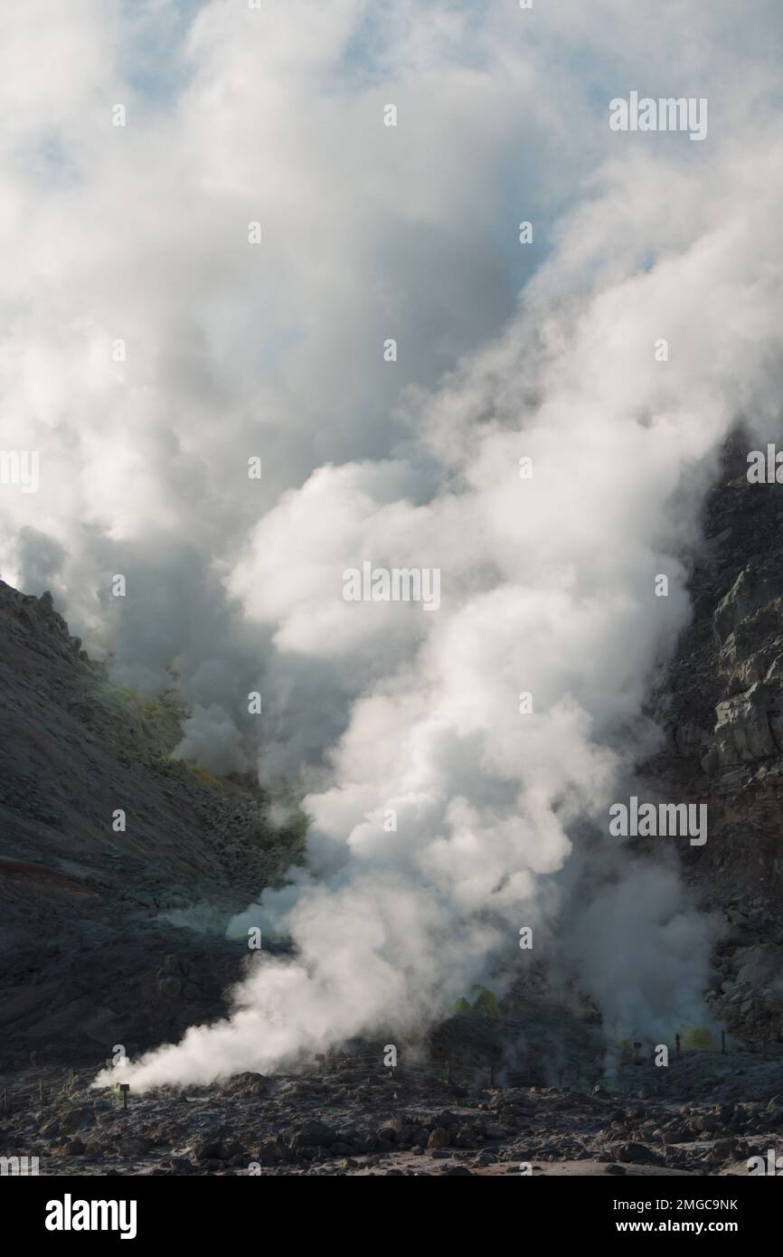 Two volcanic smoke plumes crossing Stock Photo