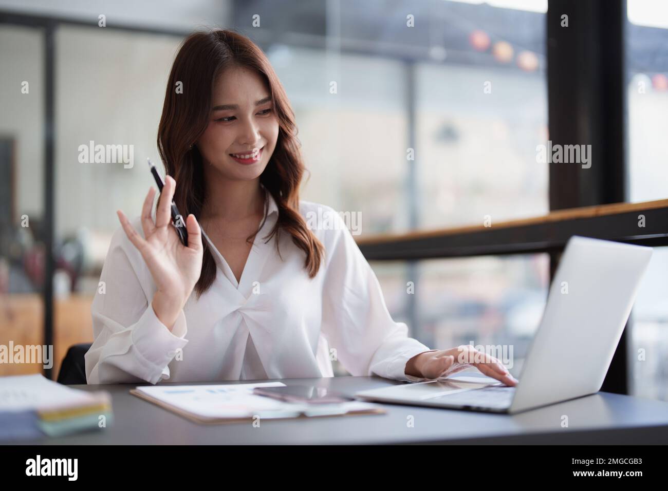 Portrait of business accountant using laptop for analyze financial data. finance, tax, accounting concept Stock Photo
