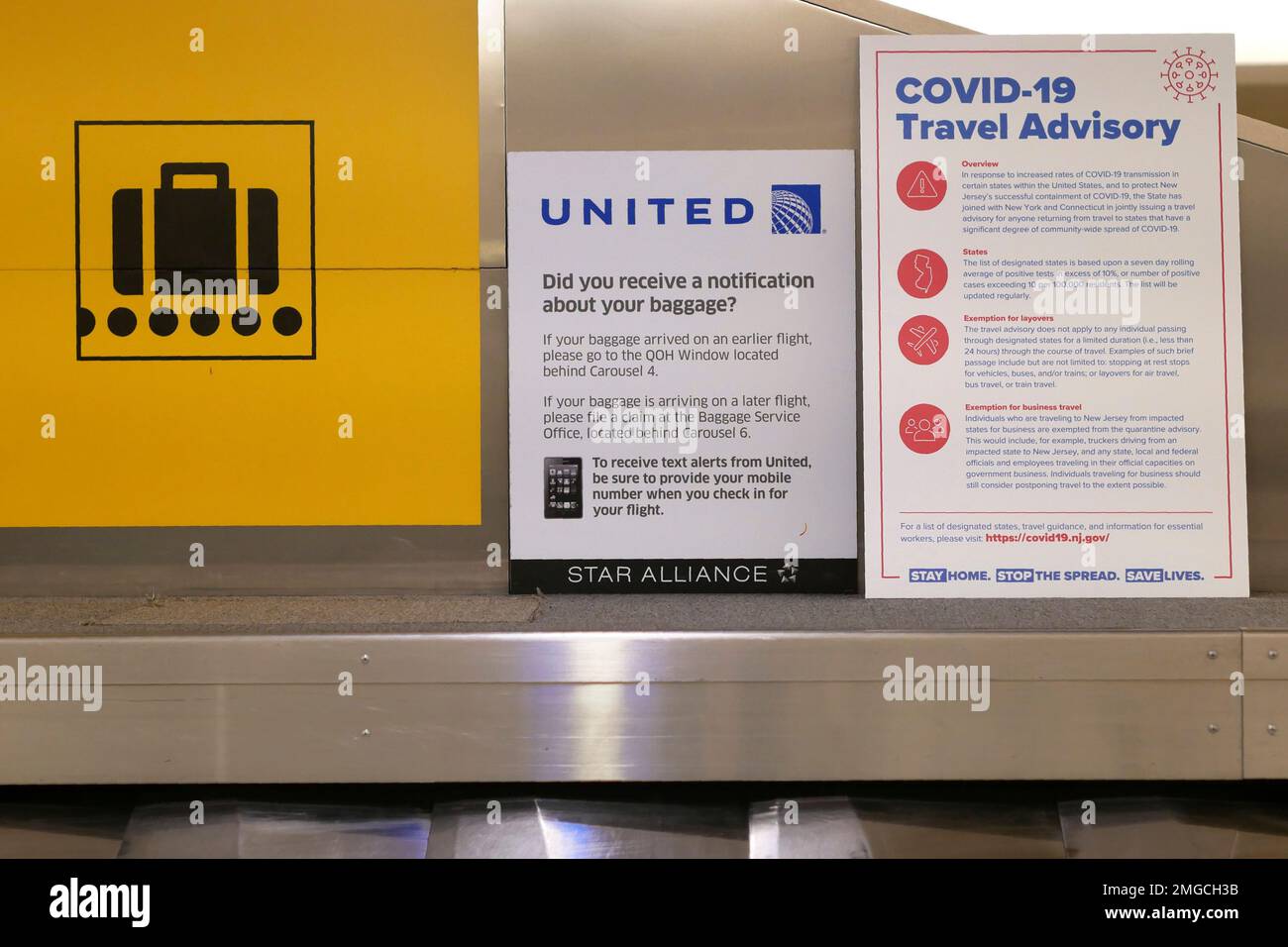 A sign warns airline passengers about a travel advisory that 