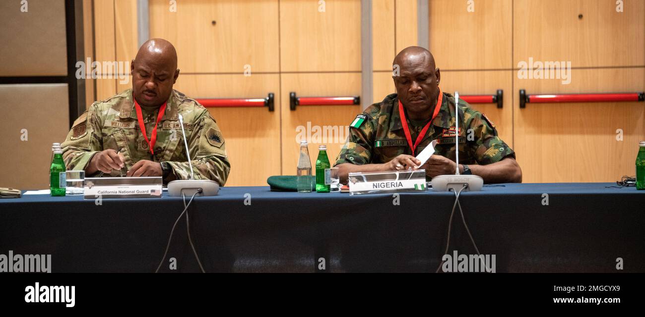 From left to right, California's National Guard State Sergeant Major Lynn Williams and Nigeria's Warrant Officer Abdullahi Baba make notes during the 2022 Africa Senior Enlisted Leaders Conference. California and Nigeria have worked together in the State Partnership Program since 2006. Stock Photo