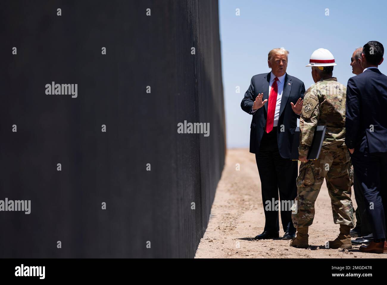 President Donald Trump tours a section of the border wall, Tuesday ...