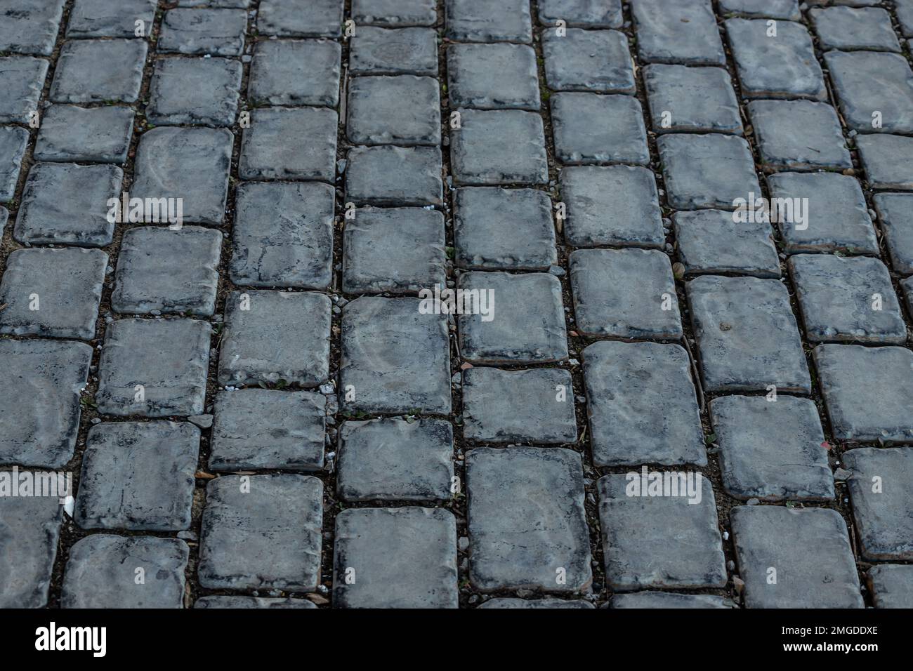 Cobble Stone Road In Lines Grey Background close-up Stock Photo - Alamy