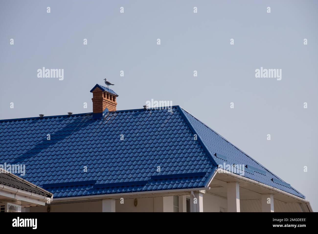 detail of roof of the house against blue sky Stock Photo - Alamy