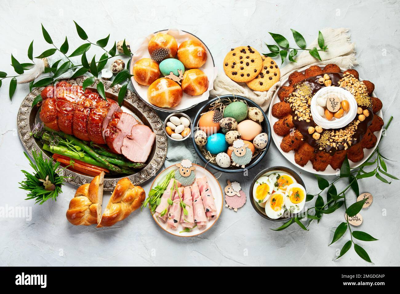 Classic Easter ham dinner. Top view table scene on a white background