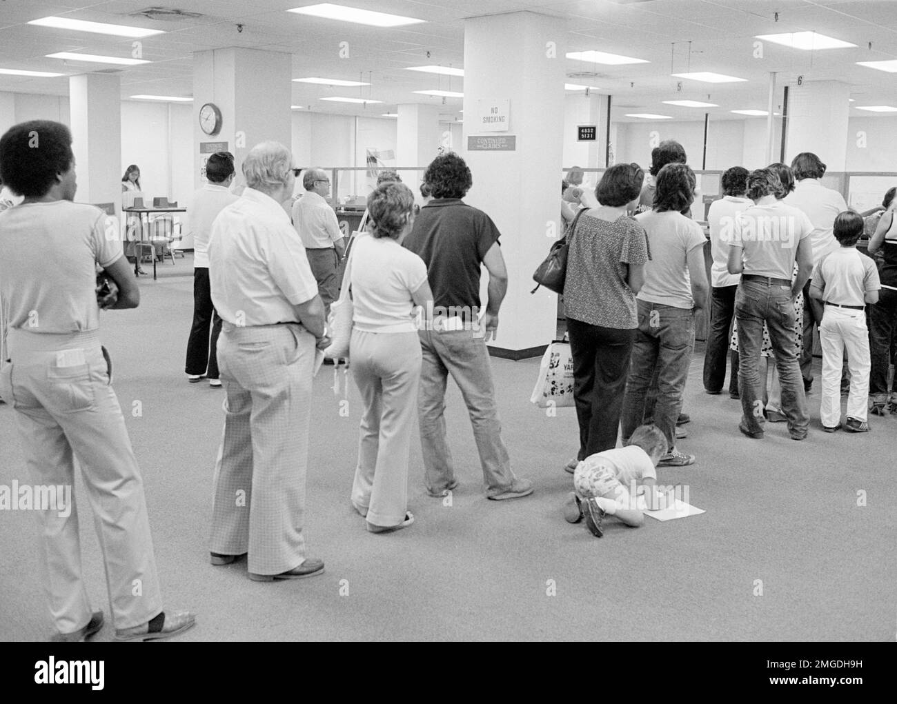 People stand in line at Hartford, Conn., June 23, 1980, to collect