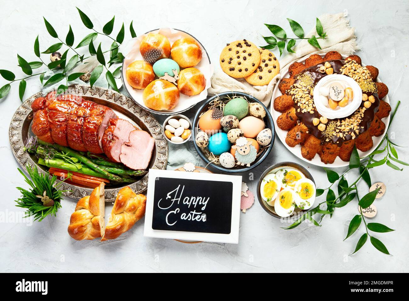 Classic Easter ham dinner. Top view table scene on a white background