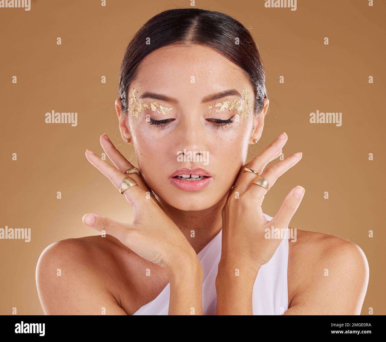 Gold cosmetics, face glitter and woman with luxury eyeshadow, makeup