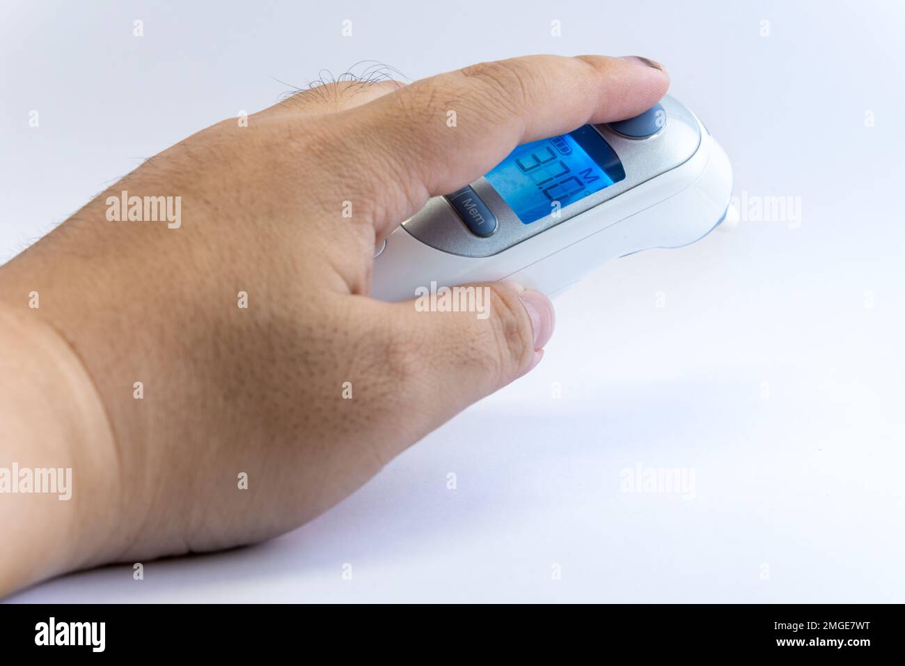 https://c8.alamy.com/comp/2MGE7WT/human-hand-hold-a-digital-infrared-thermometer-for-body-temperature-scan-from-coronavirus-disease-covid-19-flu-fever-or-other-sickness-health-care-2MGE7WT.jpg