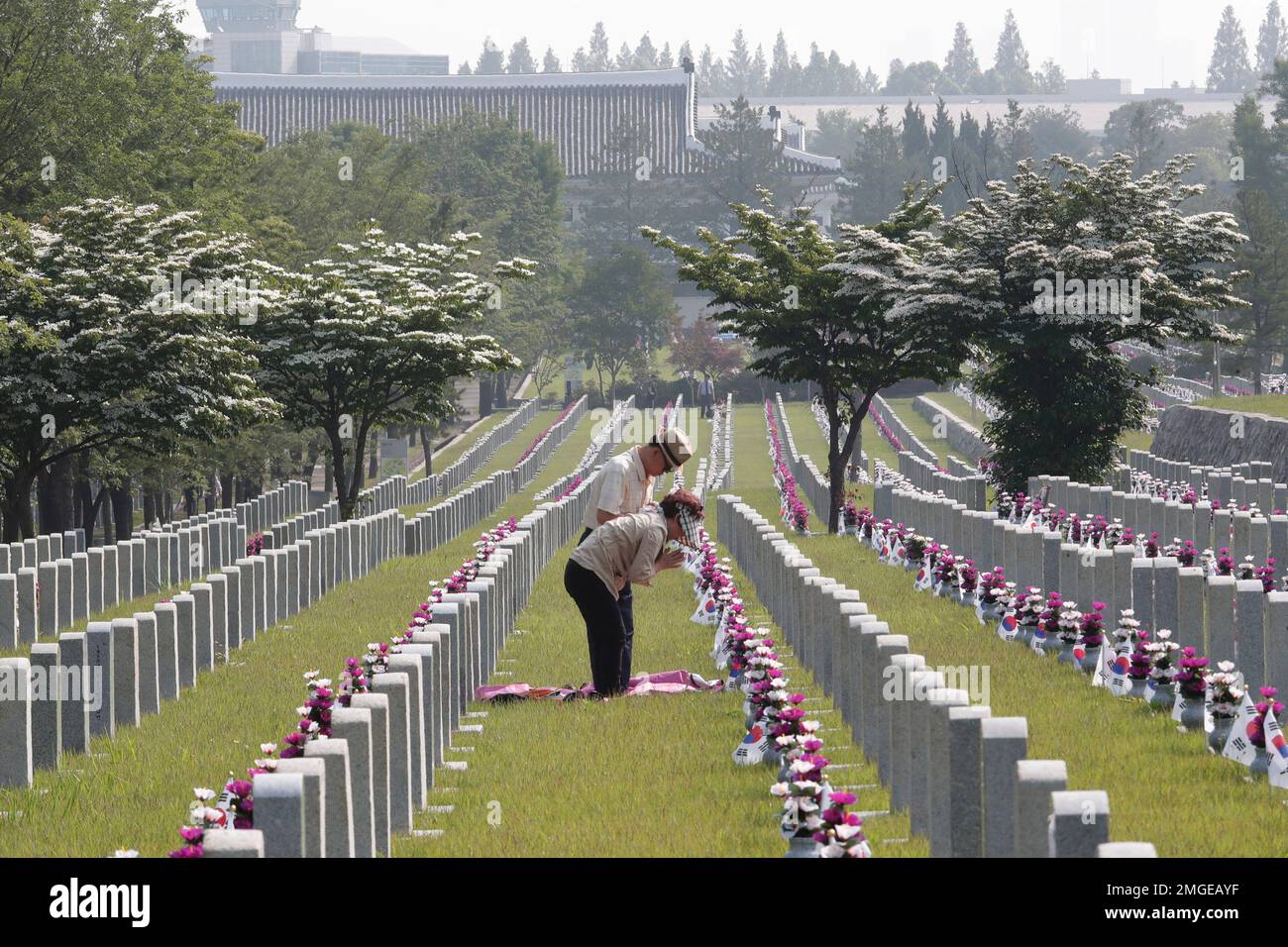 South Korean Chun Jang-geun and his wife Lee Jong-nam pray in front of ...