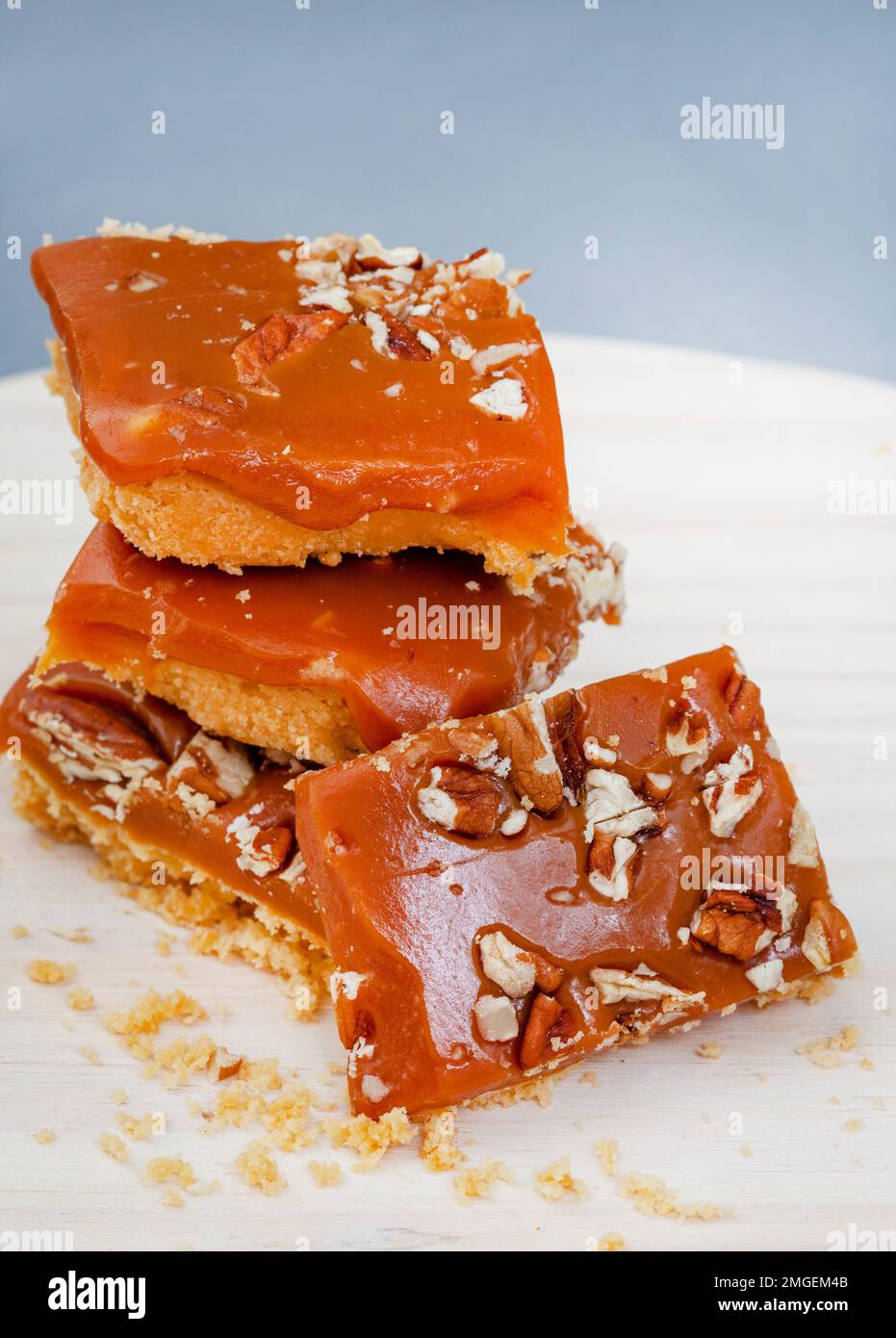 Decadent shortbread squares with salted caramel and pecan nut topping