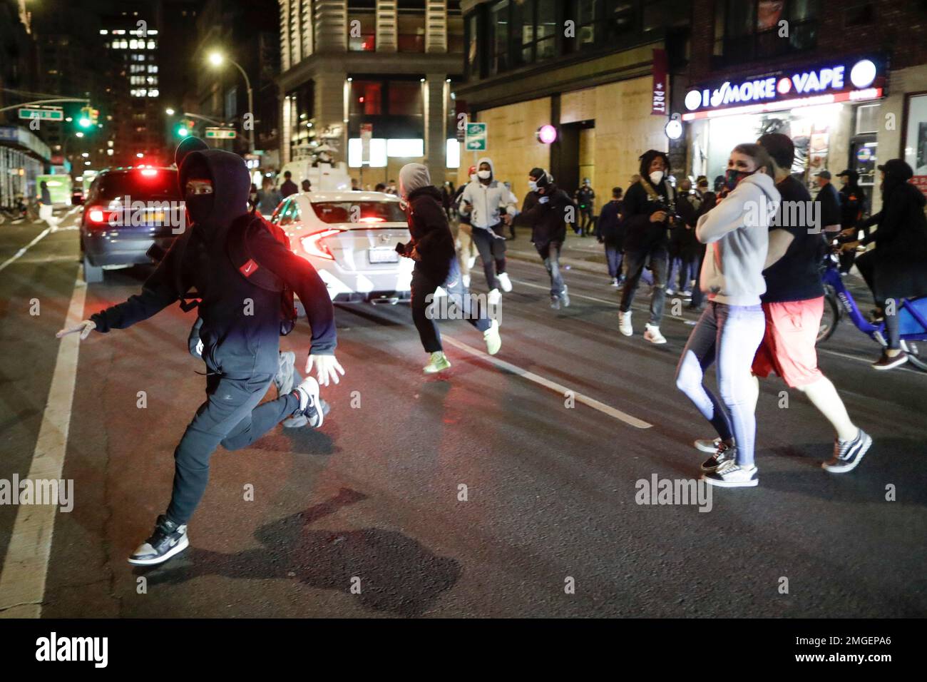 People being chased by police run past pedestrians near Union Square ...