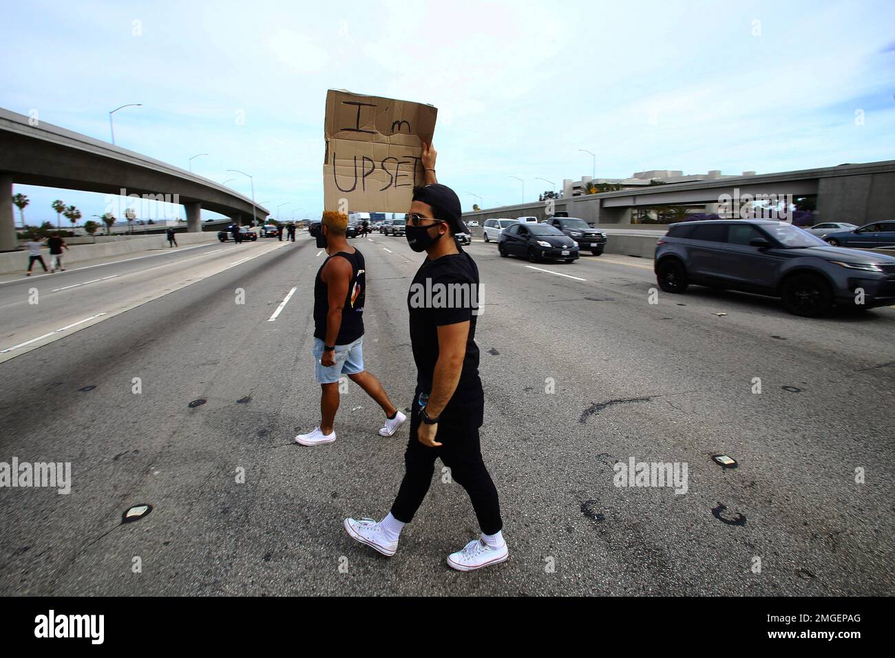 Protesters block traffic on the 405 freeway in Los Angeles during a ...