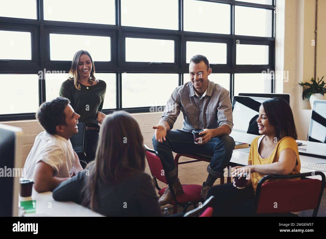 Our meetings are always fun yet insightful. creative employees having a meeting in a modern office. Stock Photo