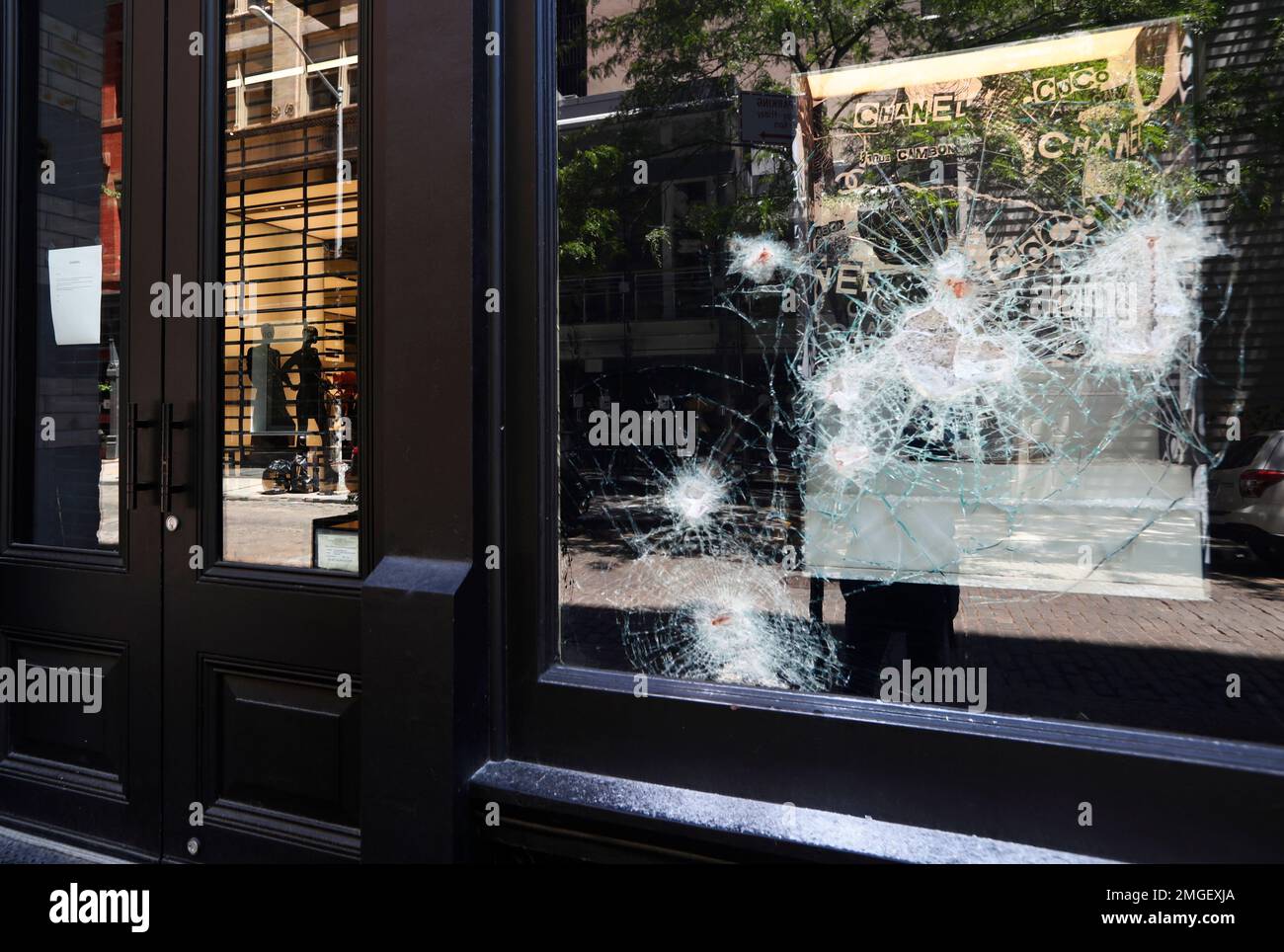 Damaged windows of a Chanel store are shown, Sunday, May 31, 2020