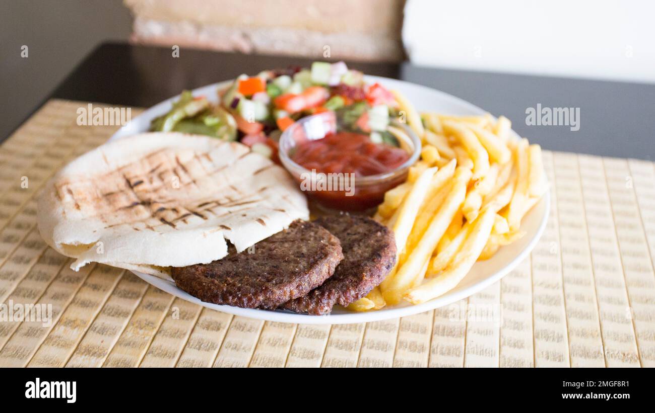 Burgers with french fries and pita bread Stock Photo Alamy