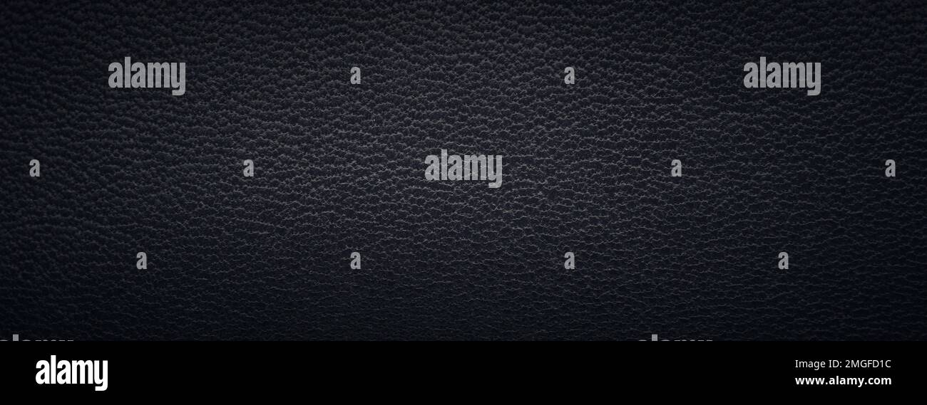 Beautiful texture of a fine black leather surface using as background or header Stock Photo