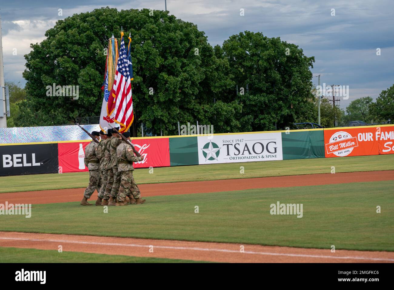 U.S. Army South color guard march to the center of the field before the ...