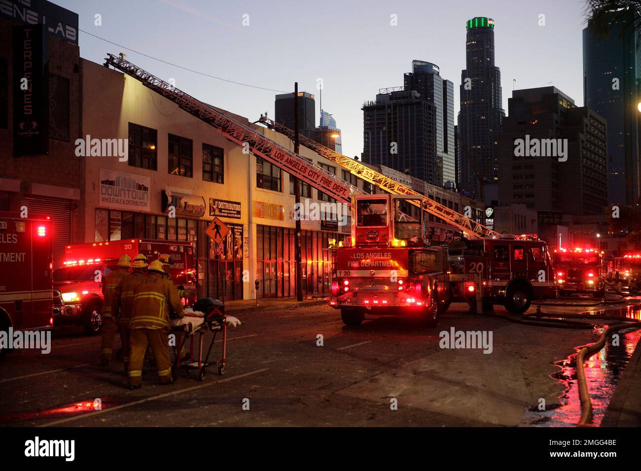 Los Angeles Fire Department firefighters work the scene of a structure ...