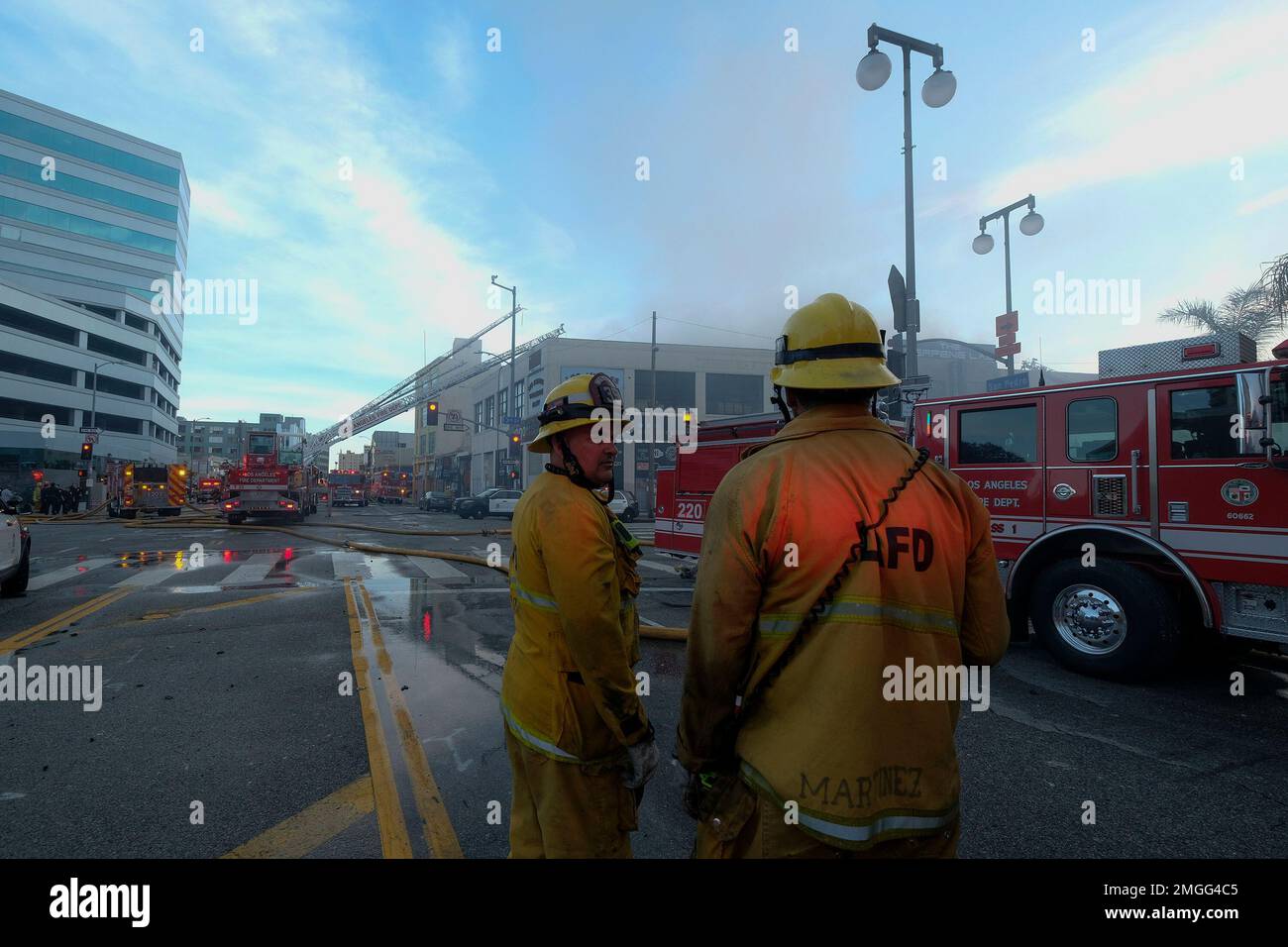 Los Angeles Fire Department firefighters work the scene of a structure ...