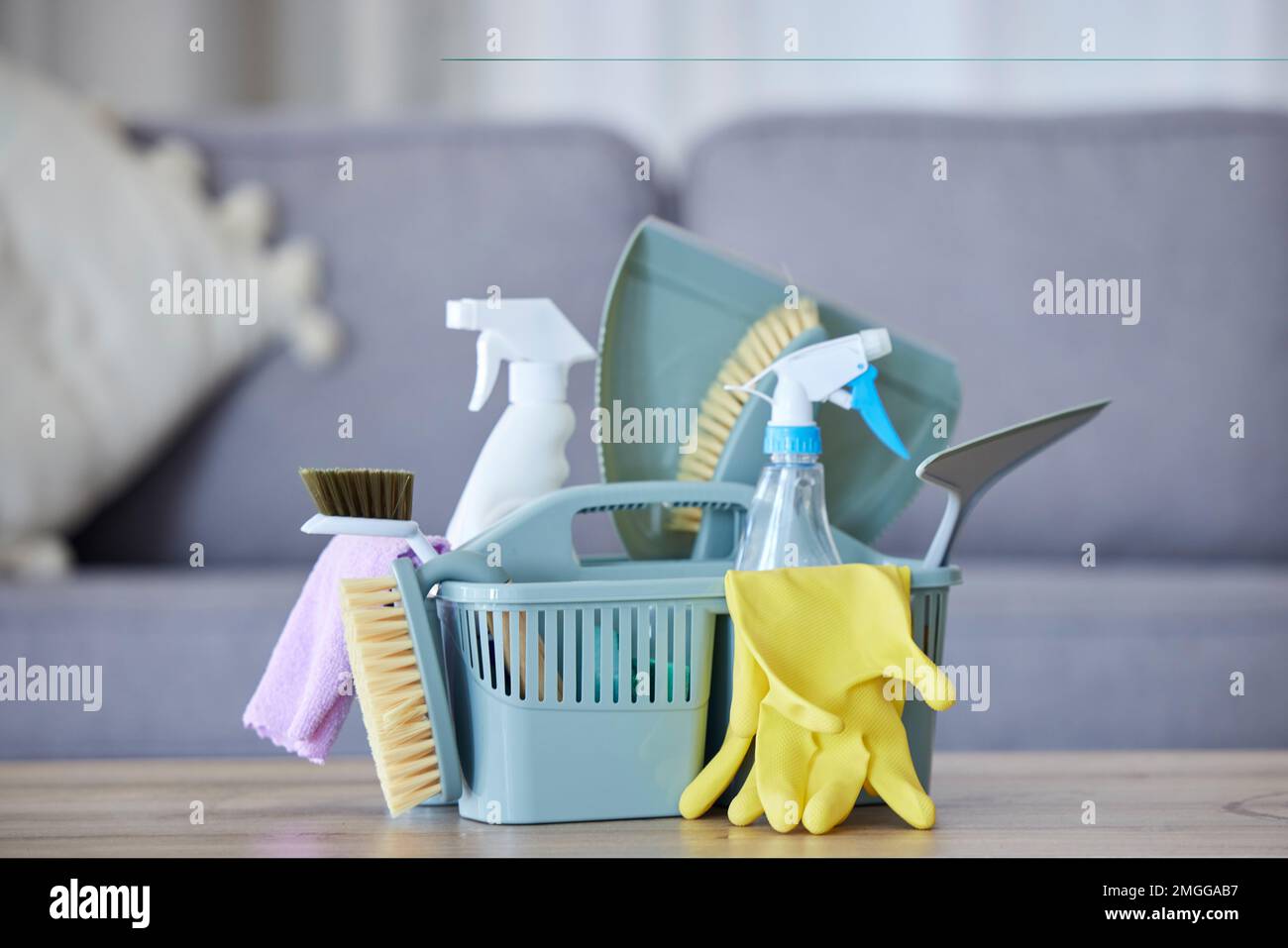 Cleaner basket, product and cloth with brush, gloves and spray bottle for health, safety and stop bacteria in home. Spring cleaning tools, chemical Stock Photo