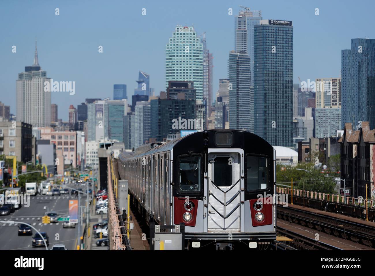A 7 train moves along Queens Blvd. Wednesday, May 13, 2020, in the ...