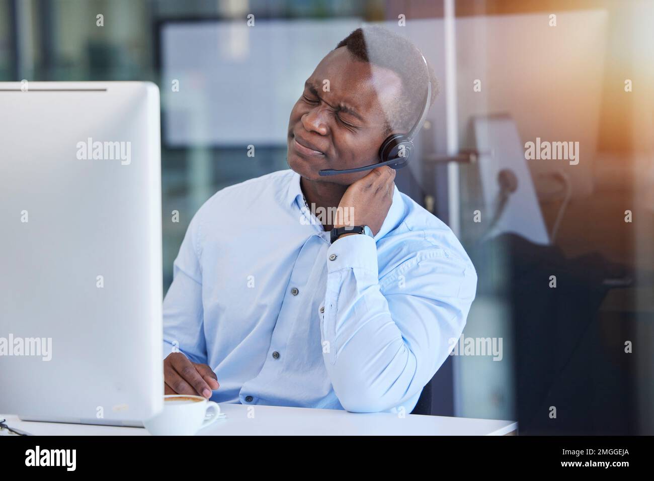 Tired, neck pain and call center with businessman at computer for headache, stress and mental health. Telemarketing, customer support and contact us Stock Photo