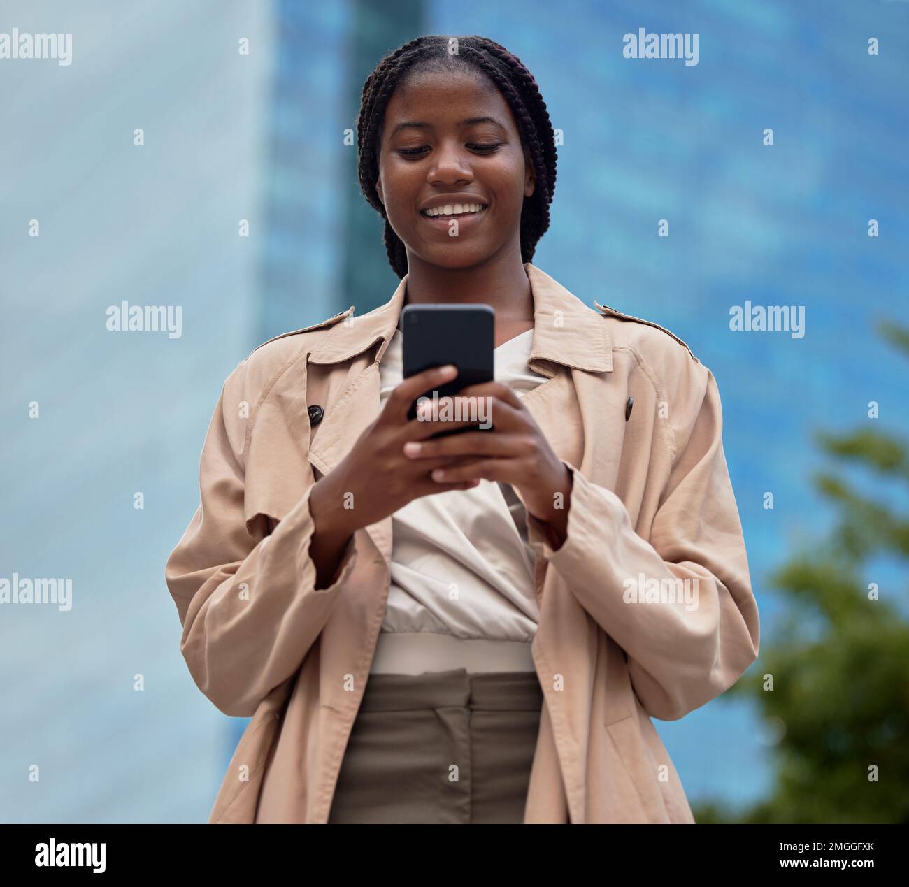 Black woman, smile and phone in social media with headphones in joy for 5G  connection in the outdoors. Happy African American female student smiling  for technology and internet on mobile smartphone