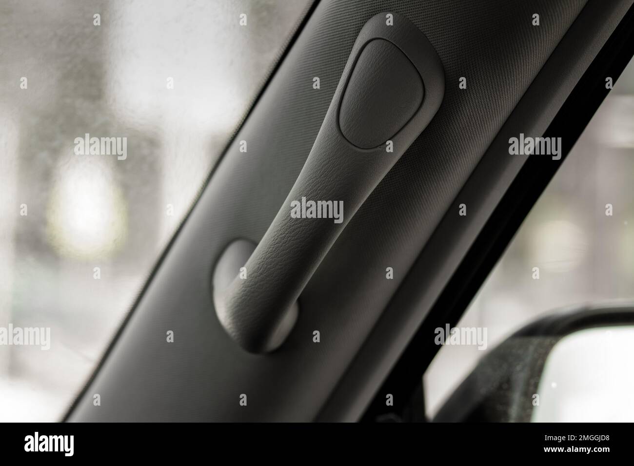 Modern car grab handle, car interior details. Car grab handler for the