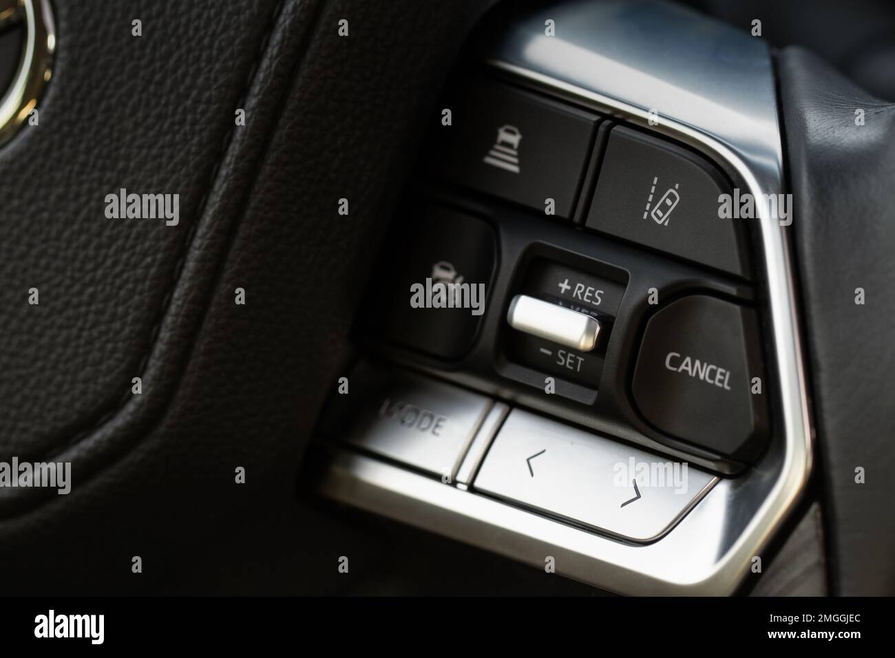 Cruise control switch closeup. Adaptive cruise control leaver. Cruise