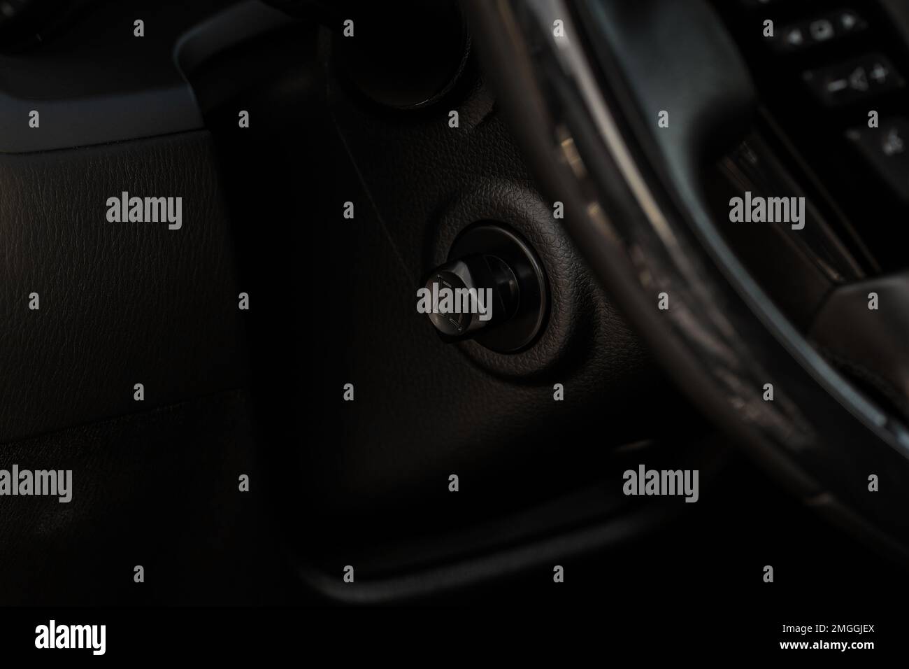 Adjustable steering wheel in modern car. Tilt and telescopic steering control lever. Steering